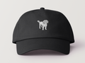 Front view of black cap with white embroidered Toto the Dog design