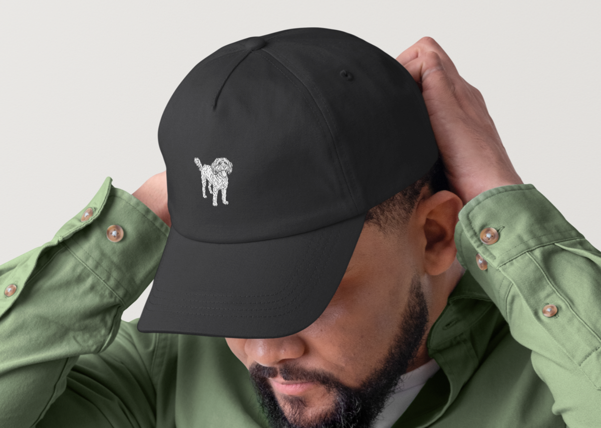 Model wearing black embroidered Toto the Dog cap